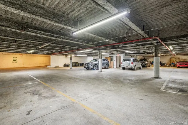a view of parking garage with cars