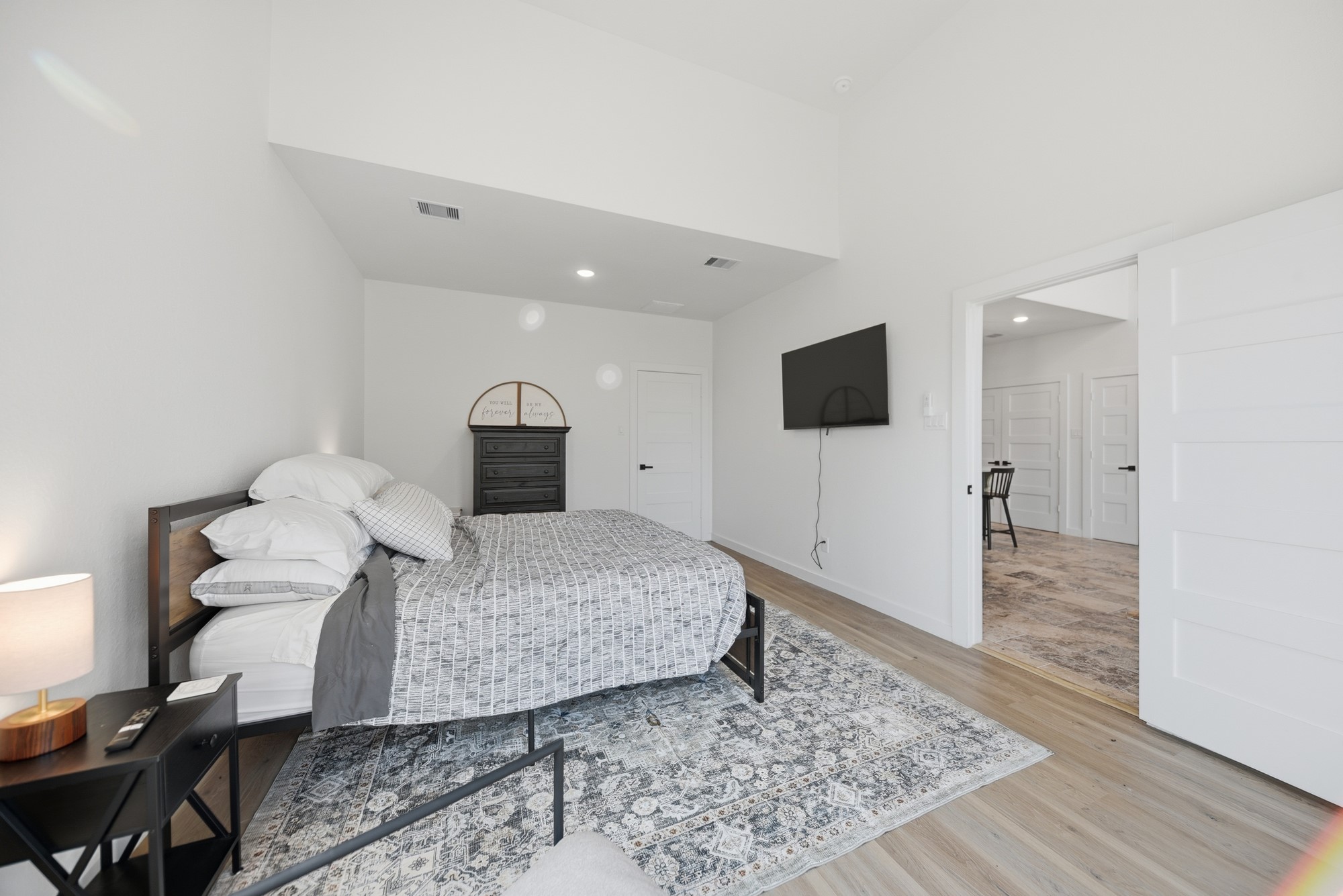 25504 Squirrel Road New Ulm, TX 78950 - Photo 14 of 37 a bedroom with a bed and wooden floor