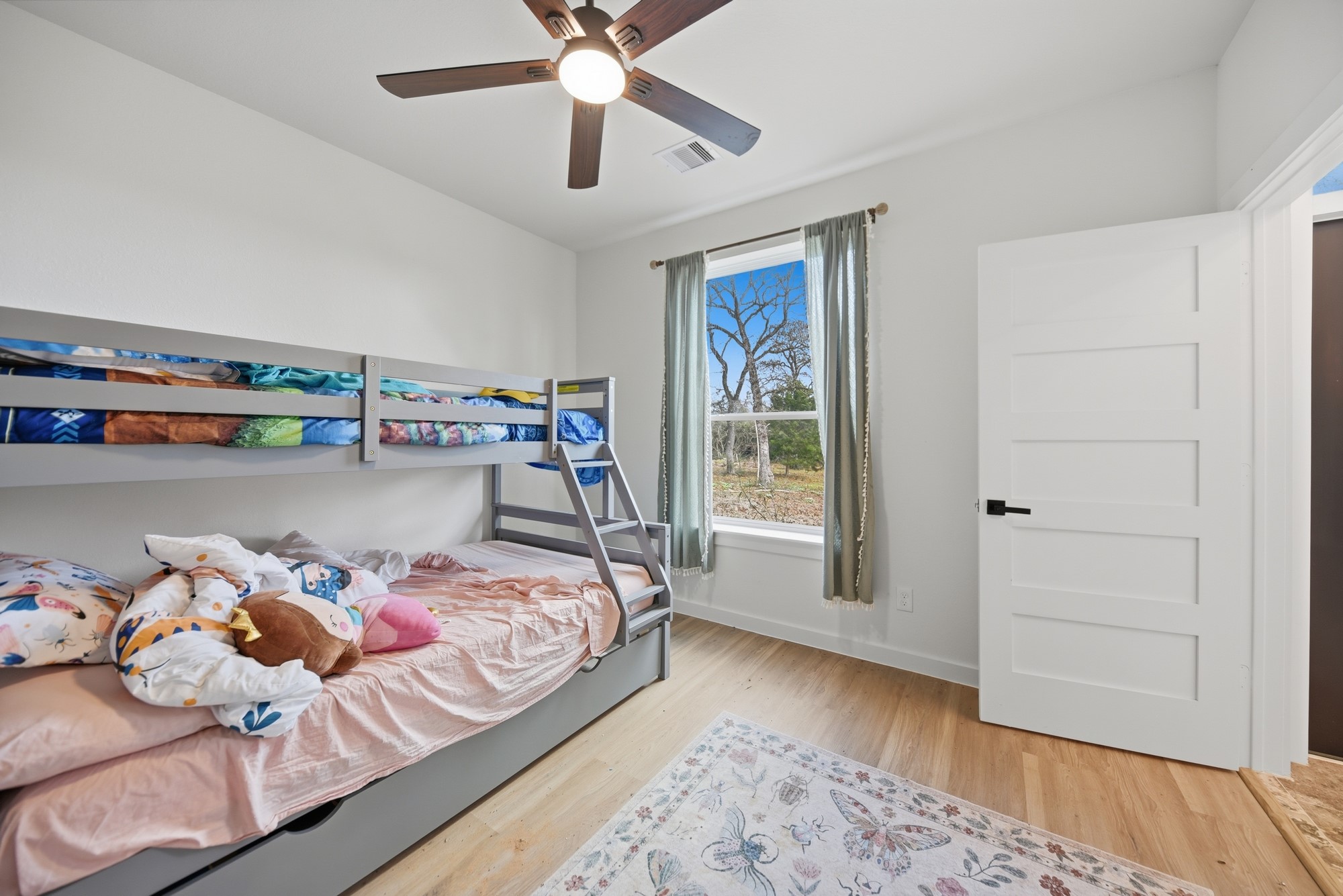 25504 Squirrel Road New Ulm, TX 78950 - Photo 17 of 37 a bed room with a bed and a window