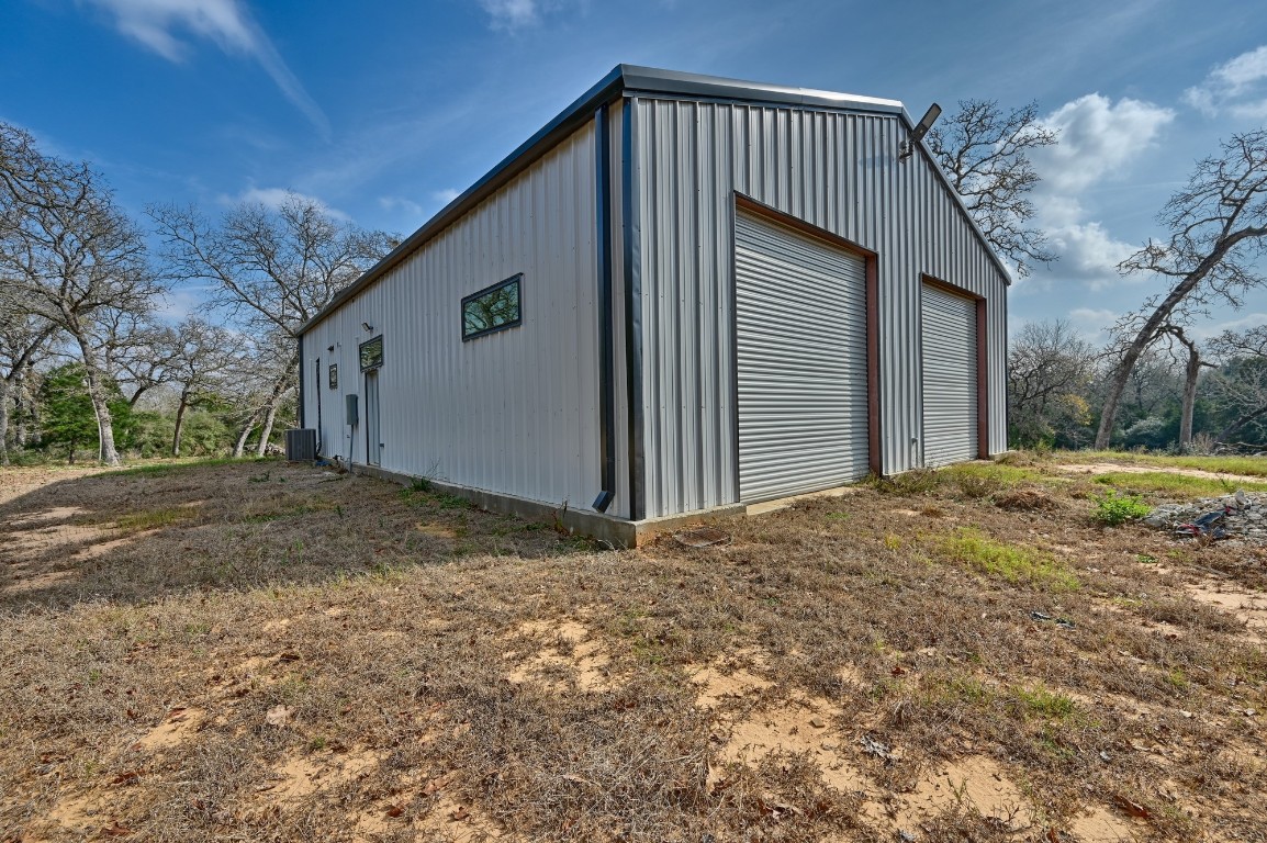 25504 Squirrel Road New Ulm, TX 78950 - Photo 29 of 37 a view of a house with a backyard