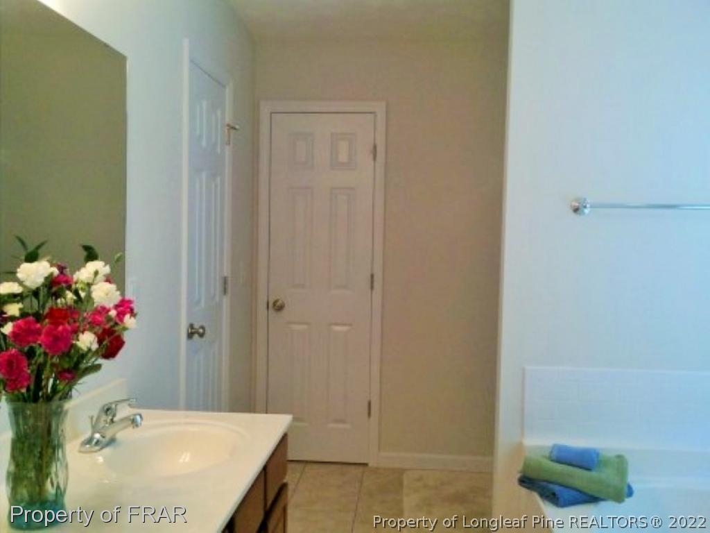 1149 Hoover Road Sanford, NC 27332 - Photo 11 of 15 a bathroom with a sink toilet and shower