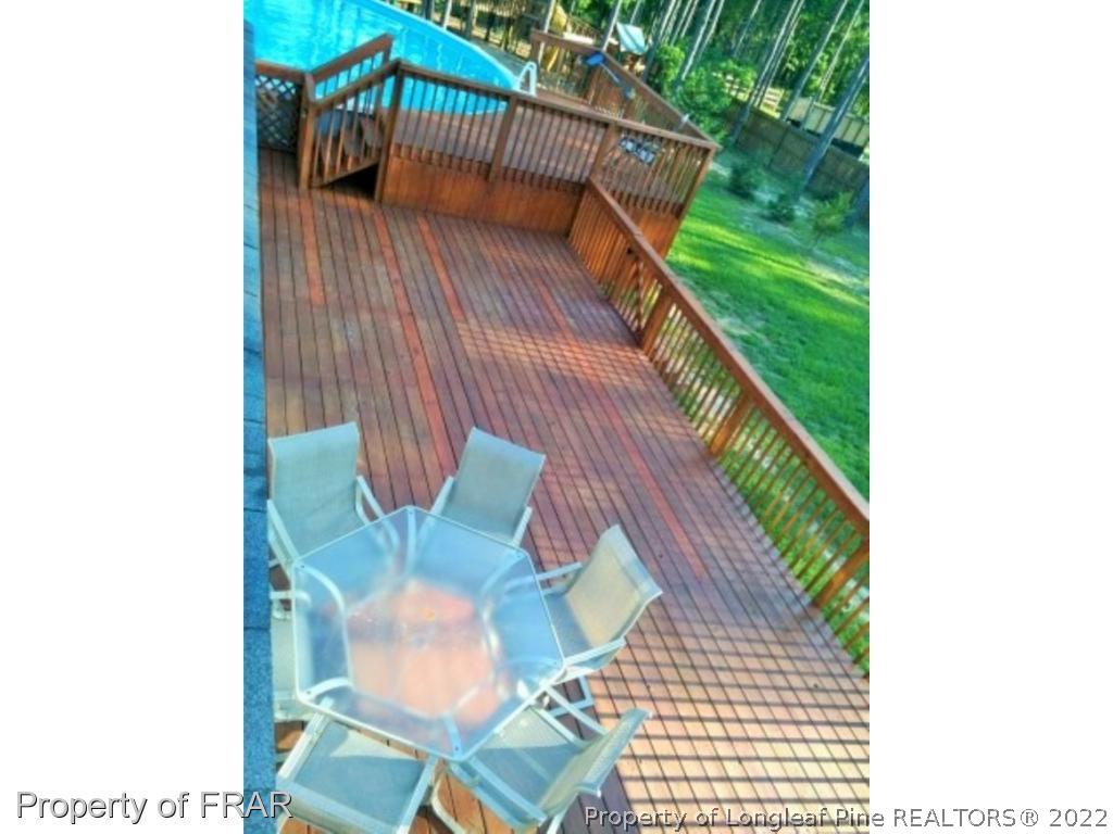 1149 Hoover Road Sanford, NC 27332 - Photo 13 of 15 a balcony with table and chairs