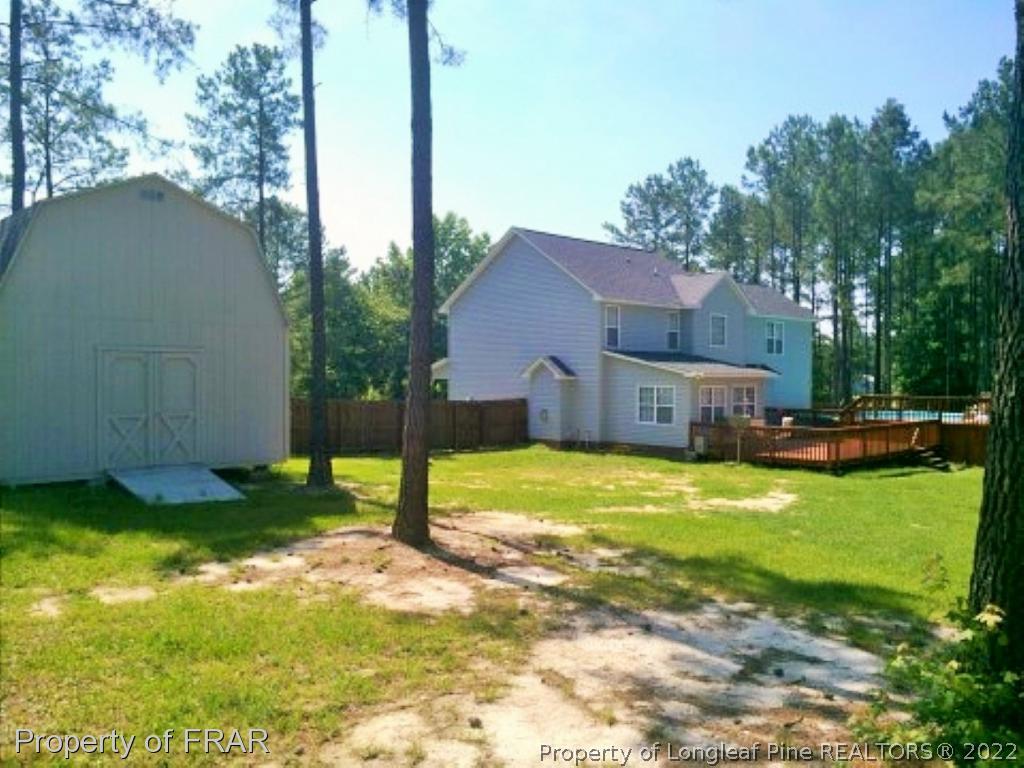 1149 Hoover Road Sanford, NC 27332 - Photo 15 of 15 a view of a house with backyard and sitting area
