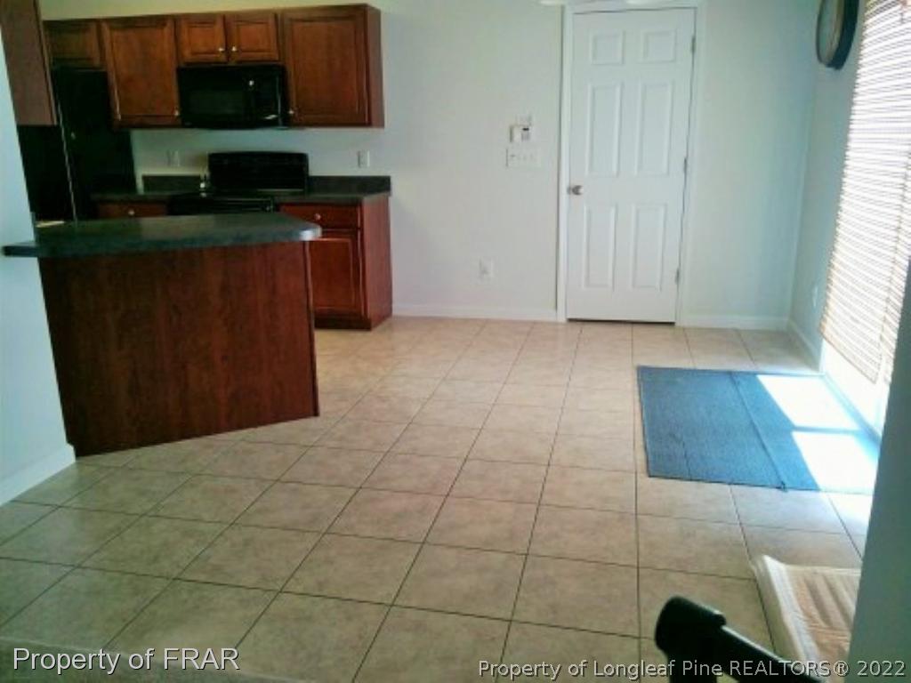 1149 Hoover Road Sanford, NC 27332 - Photo 7 of 15 a kitchen with a sink and cabinets