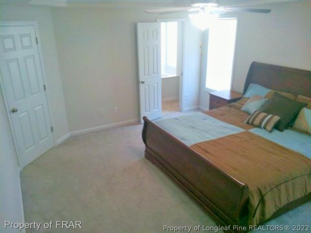 1149 Hoover Road Sanford, NC 27332 - Photo 10 of 15 a bedroom with a bed and window