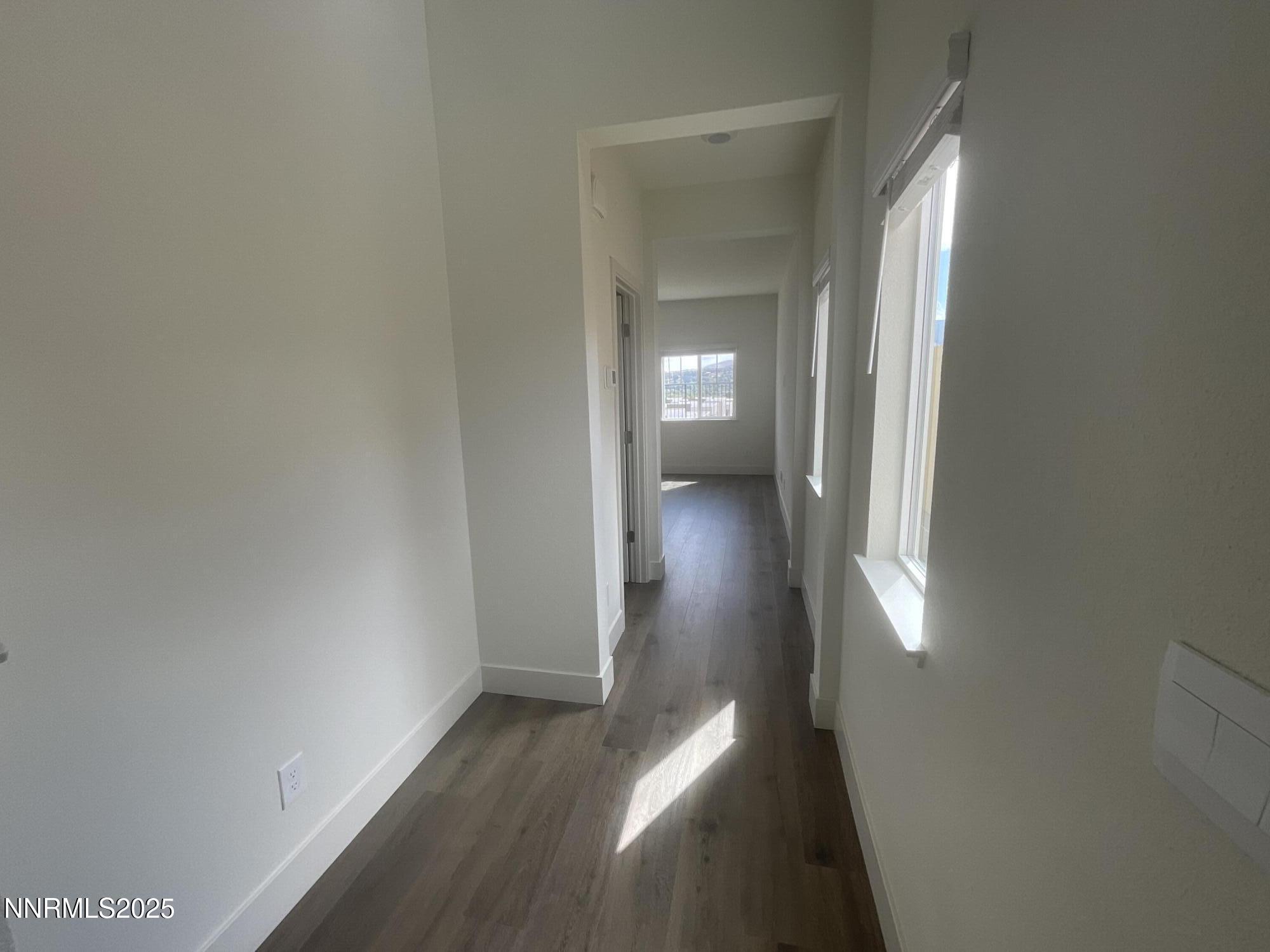 4128 Scenic Drive Reno, NV 89523 - Photo 5 of 20 a view of a hallway with wooden floor and a mirror