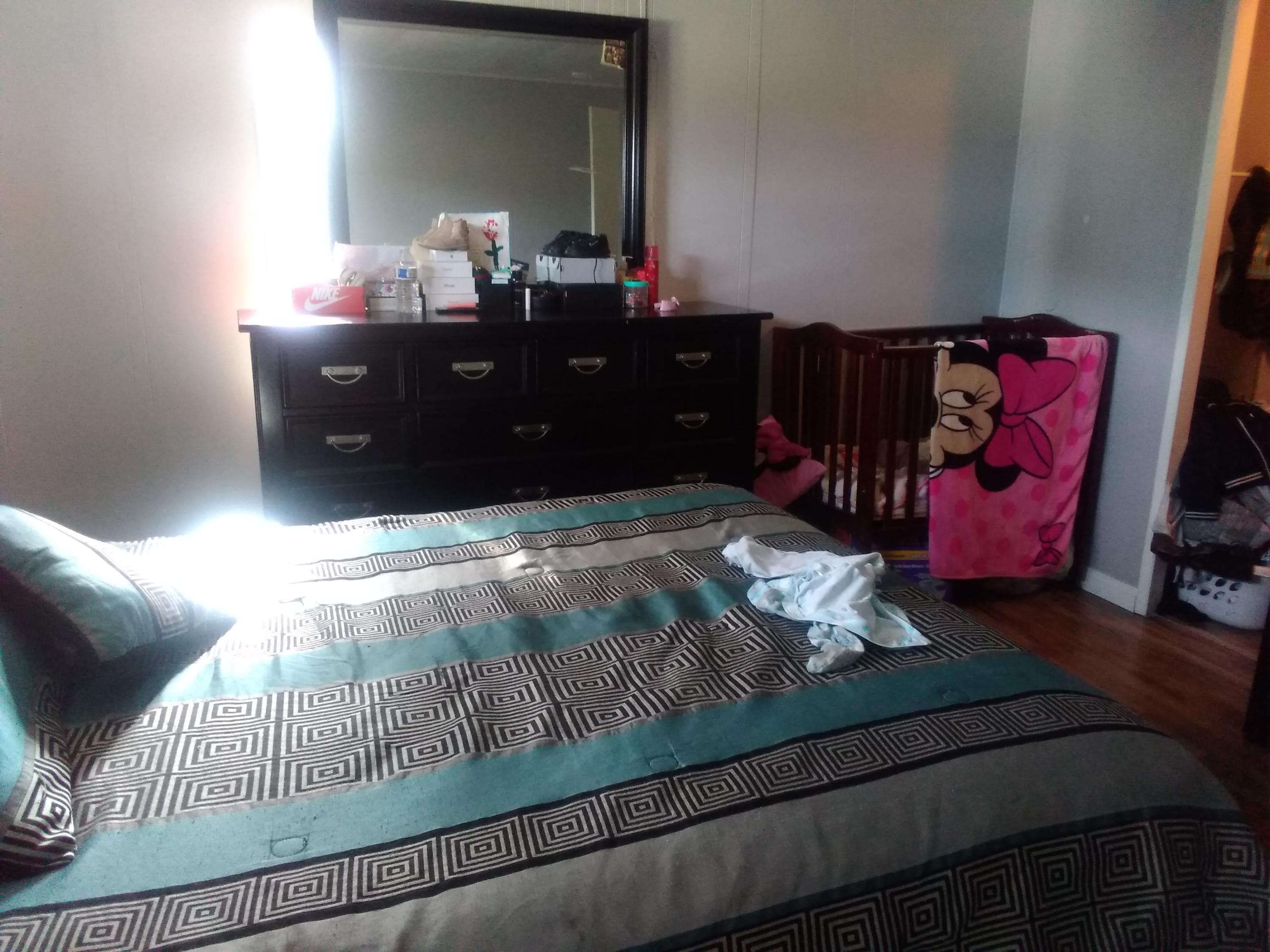 1855 East Riverside Drive Ontario, CA 91761 - Photo 5 of 13 a bedroom with a bed and a mirror
