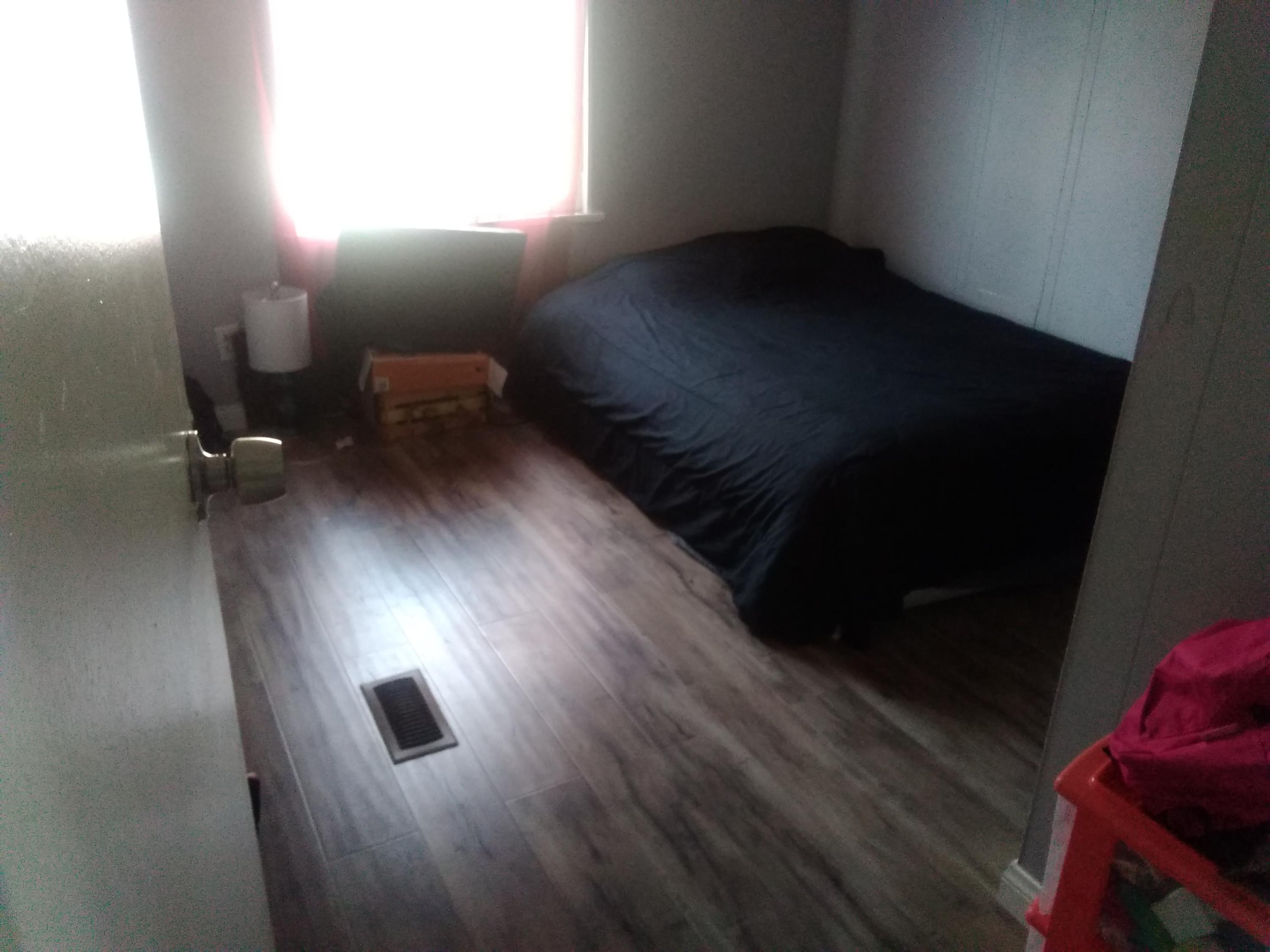 1855 East Riverside Drive Ontario, CA 91761 - Photo 6 of 13 a view of an empty room with wooden floor
