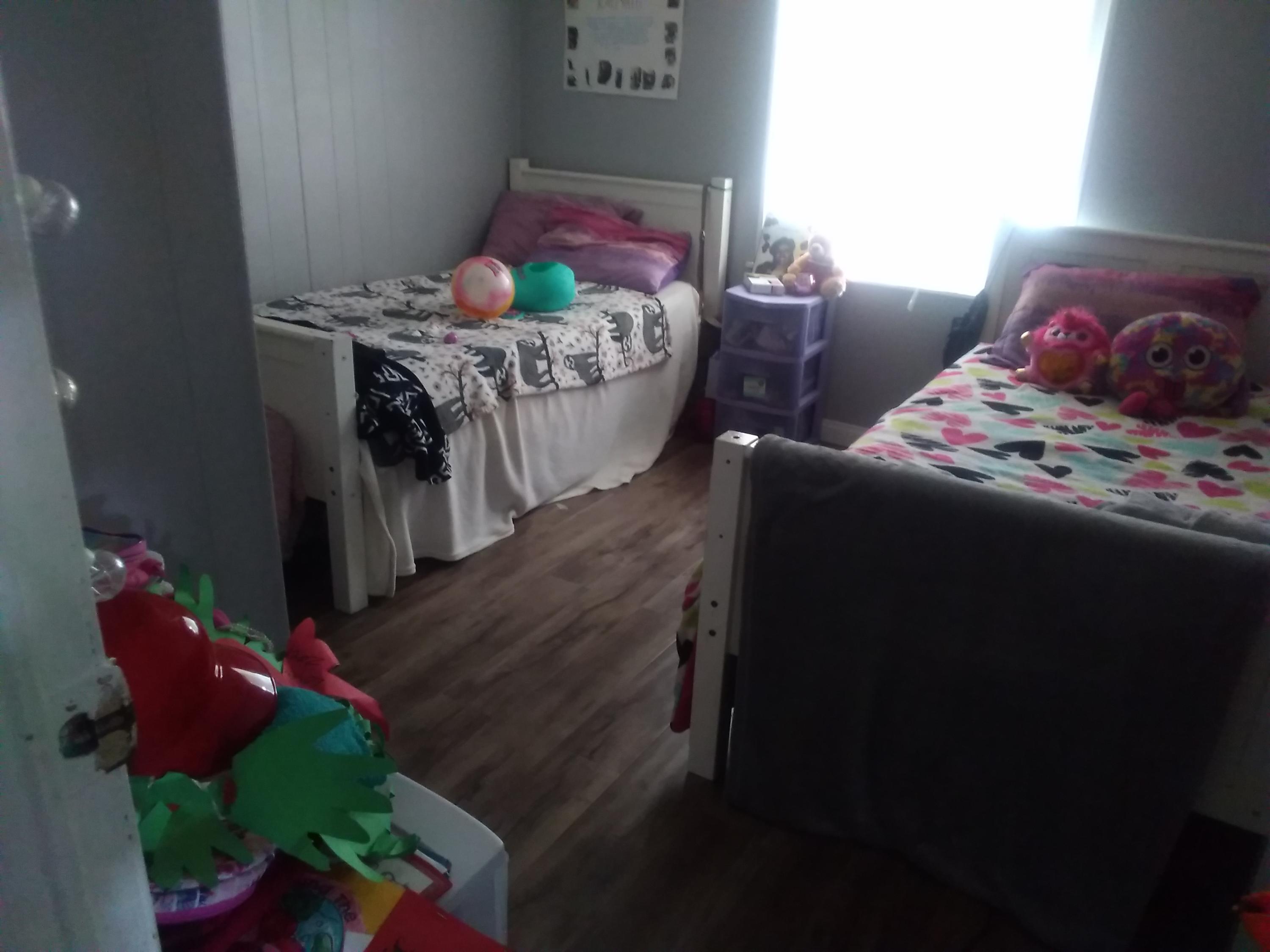 1855 East Riverside Drive Ontario, CA 91761 - Photo 7 of 13 a bed room with furniture and a potted plant