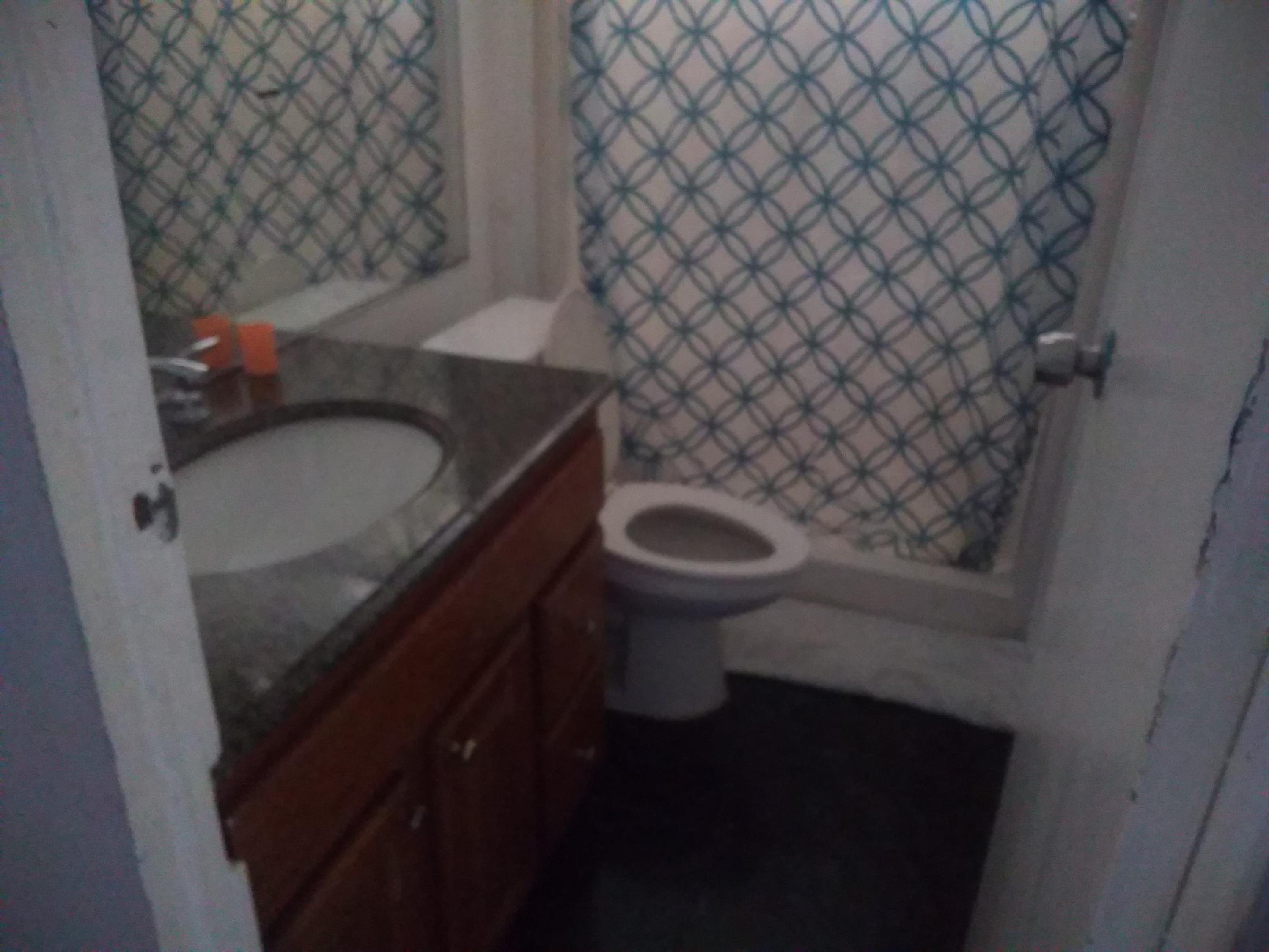 1855 East Riverside Drive Ontario, CA 91761 - Photo 9 of 13 a bathroom with a granite countertop sink and a toilet
