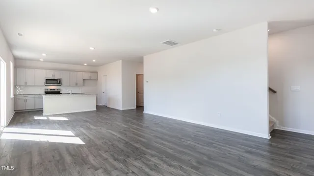 a view of kitchen with wooden floor