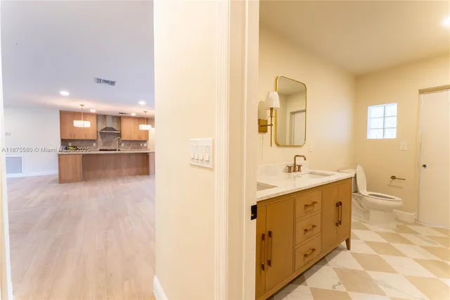 a bathroom with a double vanity sink and mirror