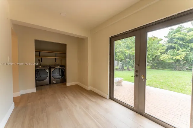 a view of empty room with floor to ceiling window