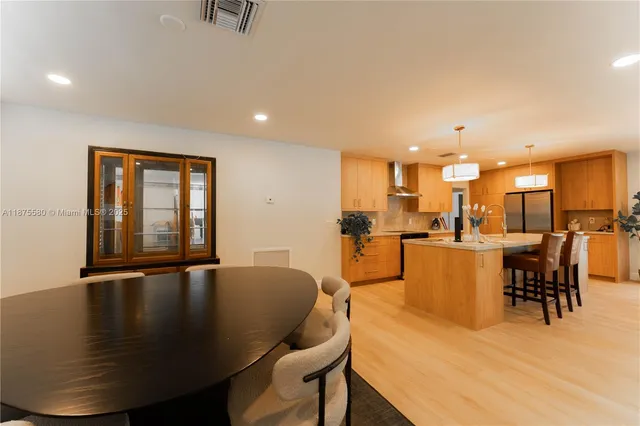 a dining room with furniture and a table