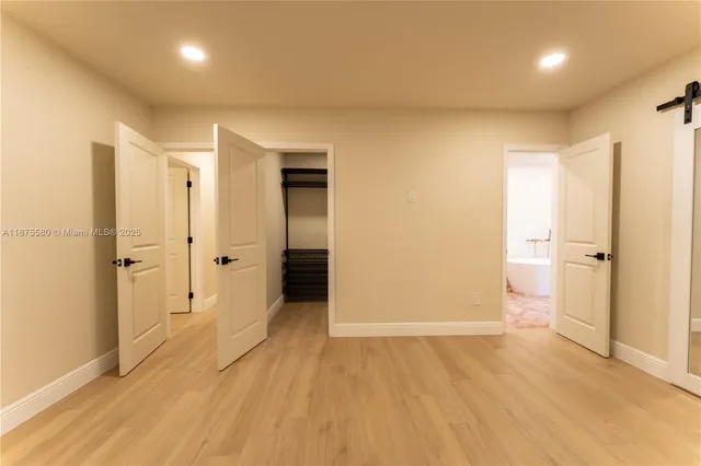 a bathroom with a sink and a large mirror