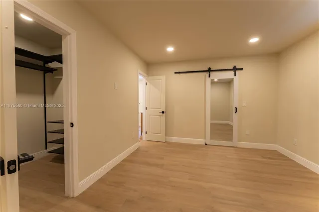 a view of entryway with wooden floor