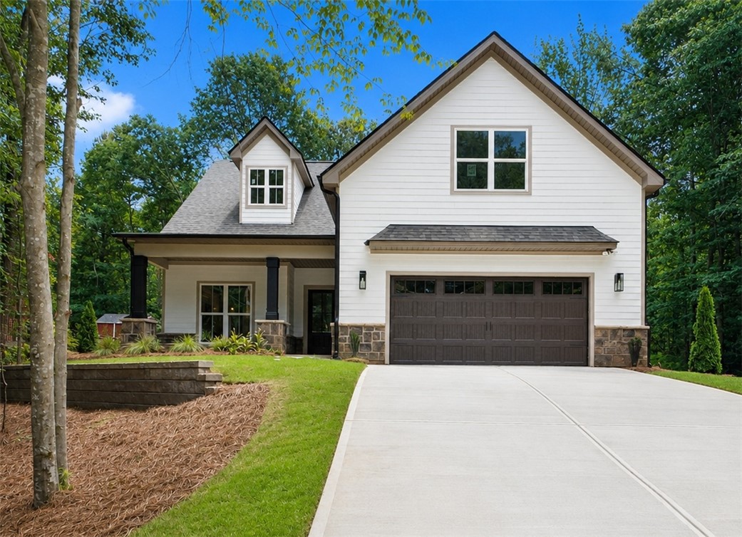 328 Point Road Westminster, SC 29693 - Photo 1 of 24 A classic facade with a dark wood garage door awaits in this suburban haven.