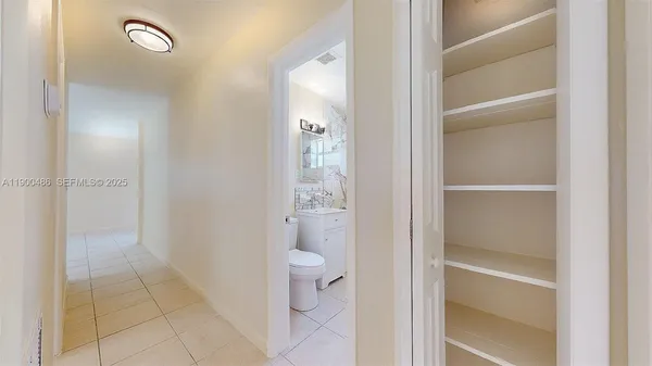 a view of a bathroom from a hallway