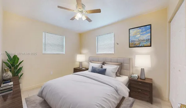 a bedroom with a bed and a potted plant