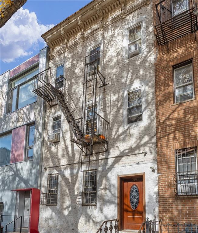 219 16th Street Brooklyn, NY 11215 - Photo 2 of 11 a street sign on a pole on a street
