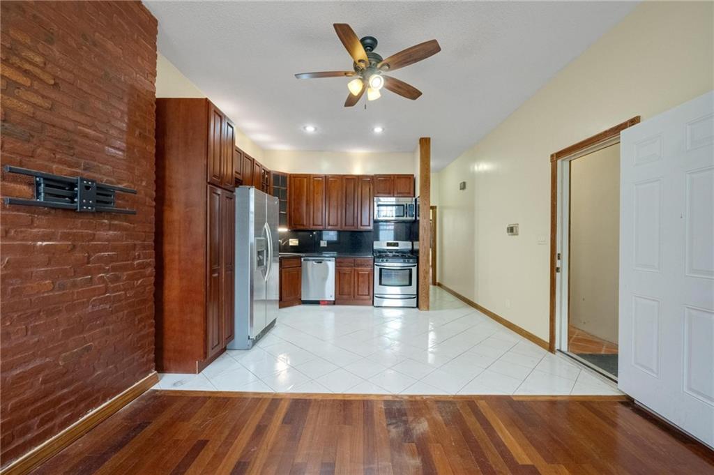 219 16th Street Brooklyn, NY 11215 - Photo 3 of 11 a view of kitchen with wooden floor