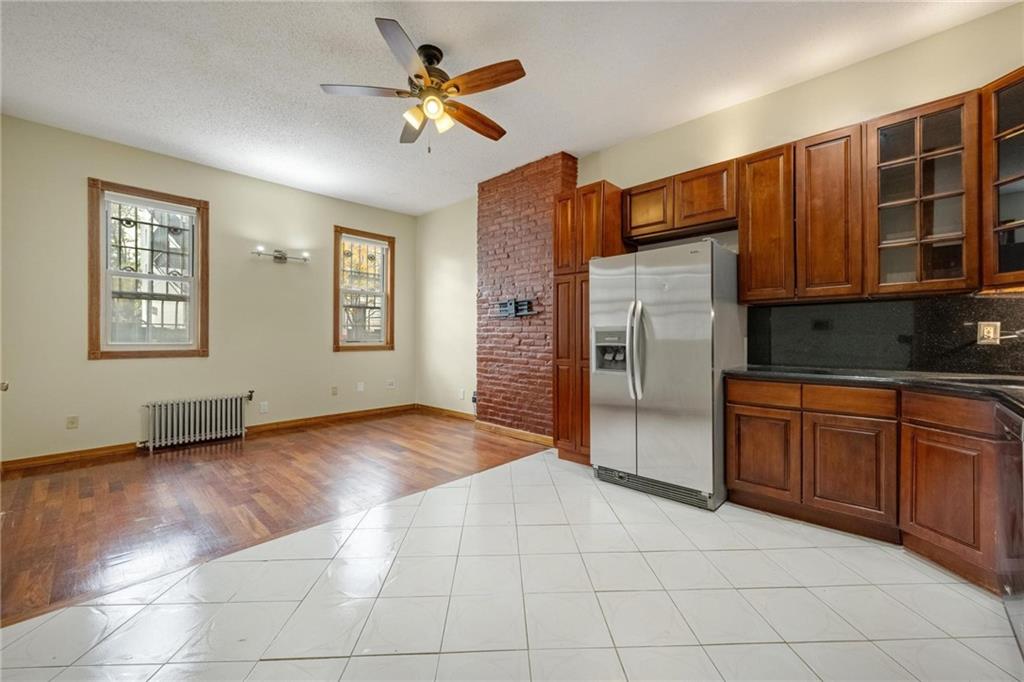 219 16th Street Brooklyn, NY 11215 - Photo 5 of 11 a view of an empty room with a kitchen