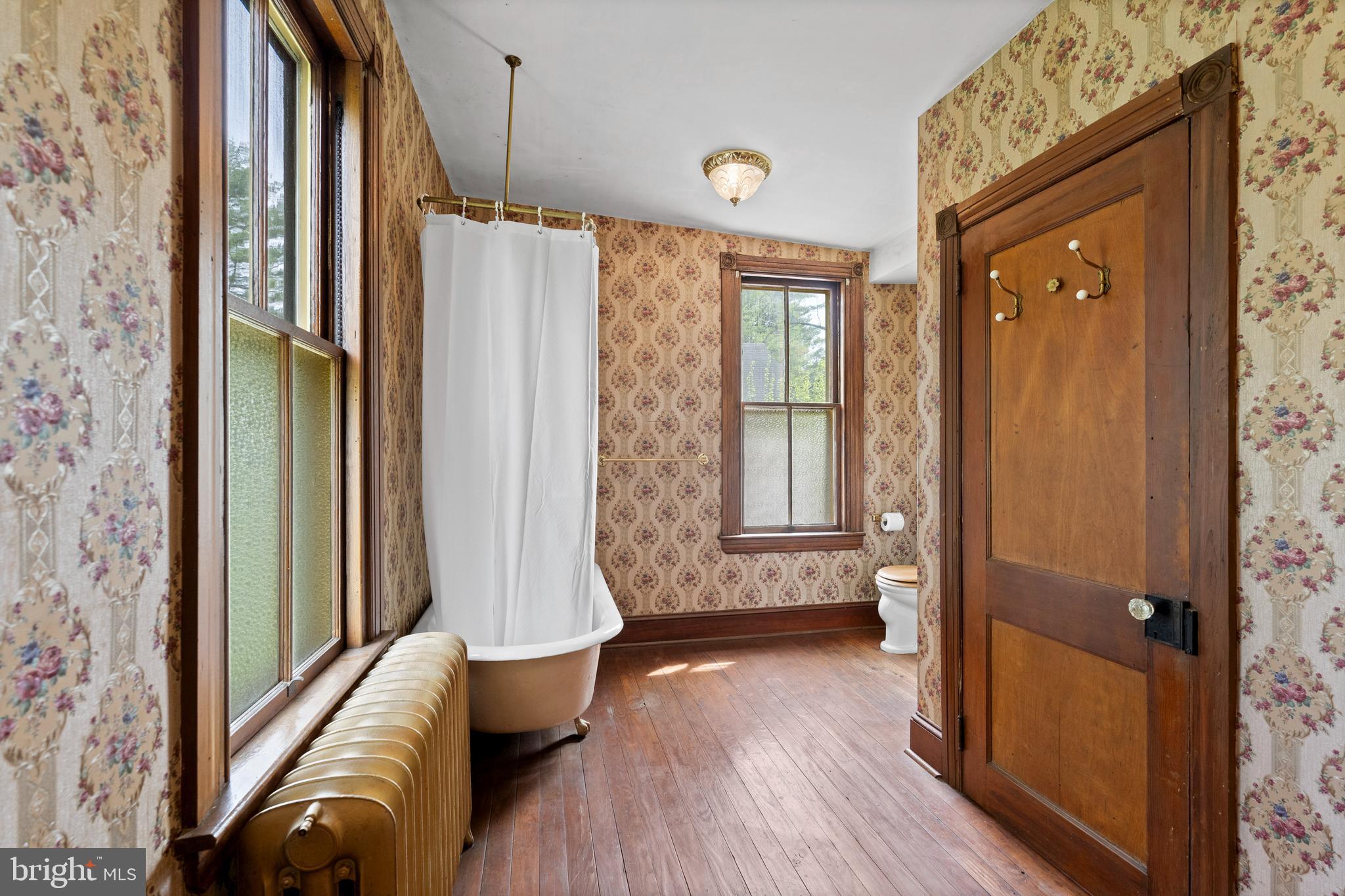 40 Barren Road Media, PA 19063 - Photo 18 of 30 a view of front door and bedroom with wooden floor