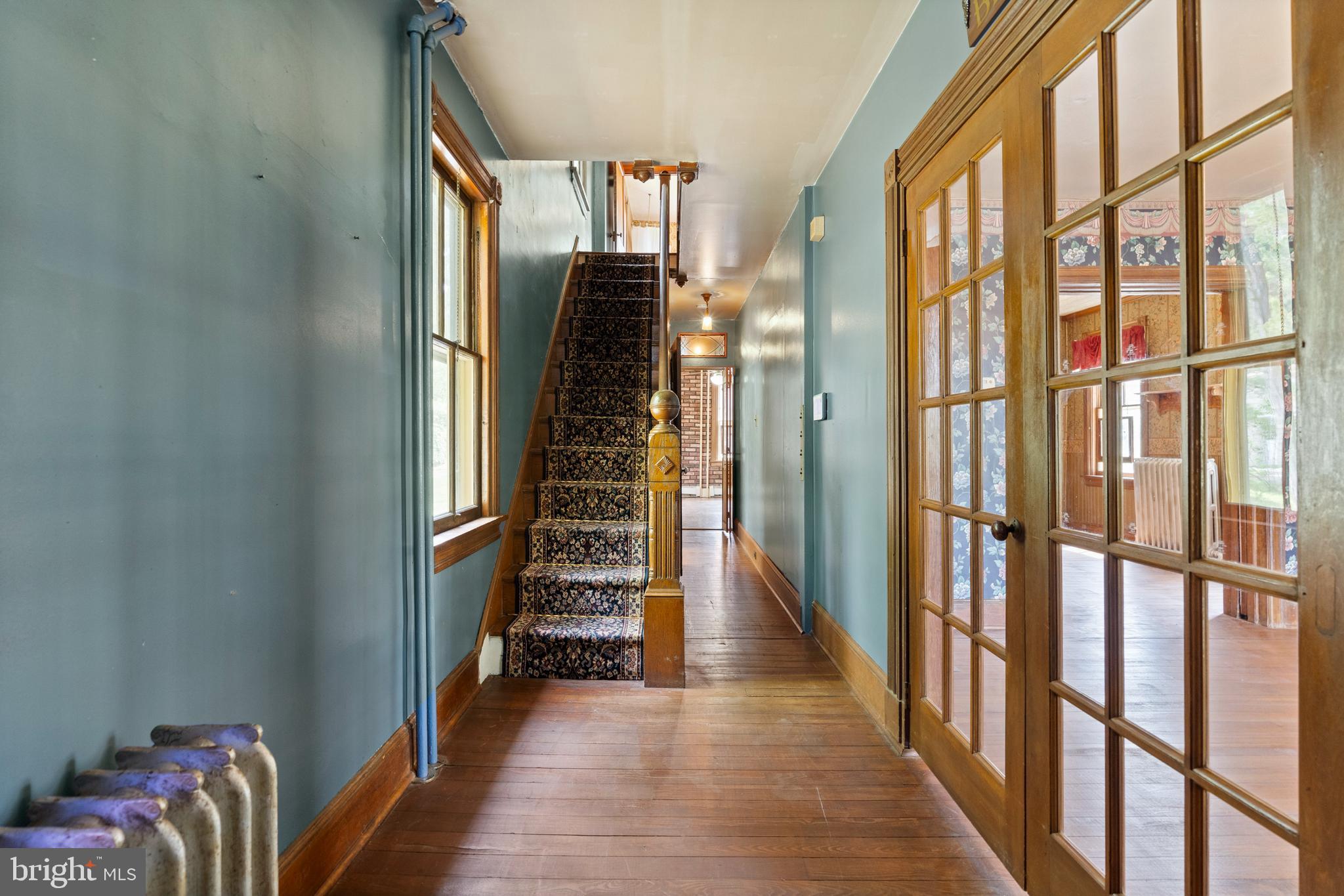 40 Barren Road Media, PA 19063 - Photo 20 of 30 a view of a hallway with wooden floor and door
