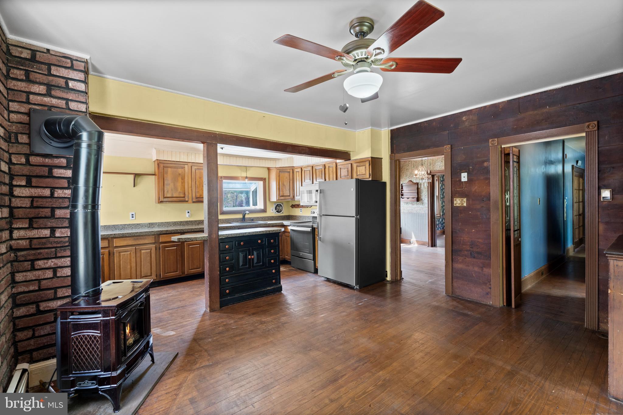 40 Barren Road Media, PA 19063 - Photo 26 of 30 a kitchen with stainless steel appliances kitchen island granite countertop a refrigerator a stove a sink dishwasher with a dining table and chairs