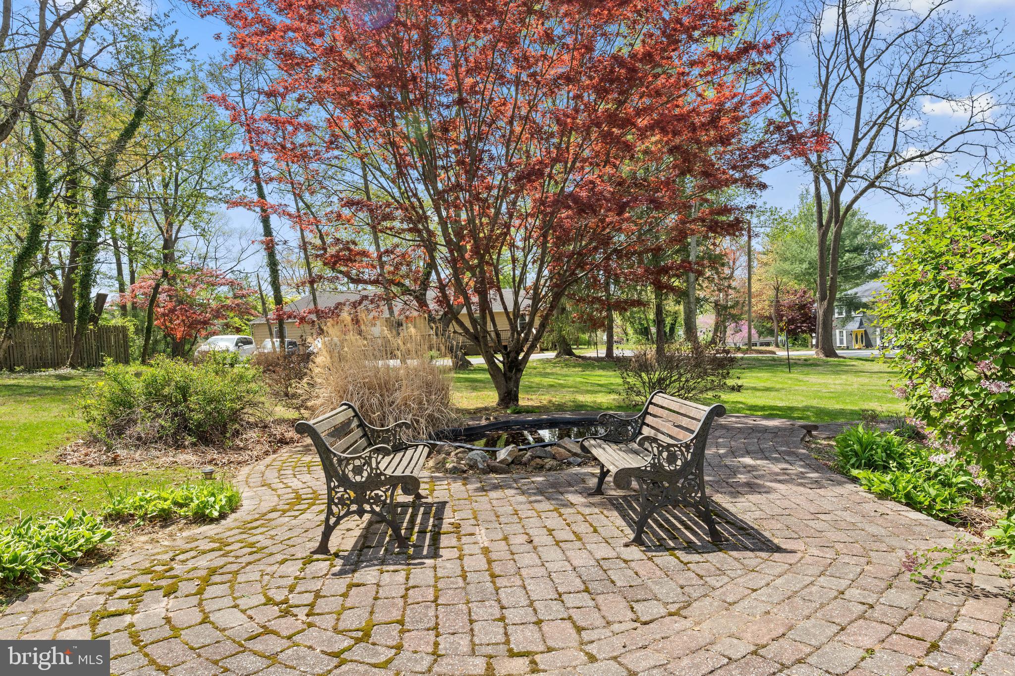 40 Barren Road Media, PA 19063 - Photo 6 of 30 a table and chairs in a garden