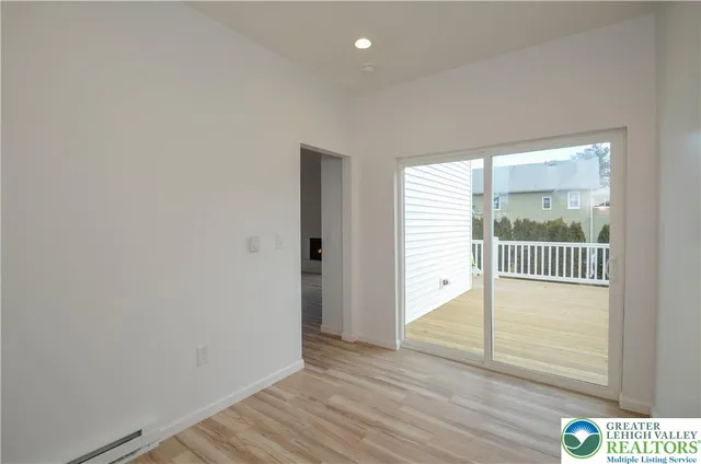a view of hallway with wooden floor