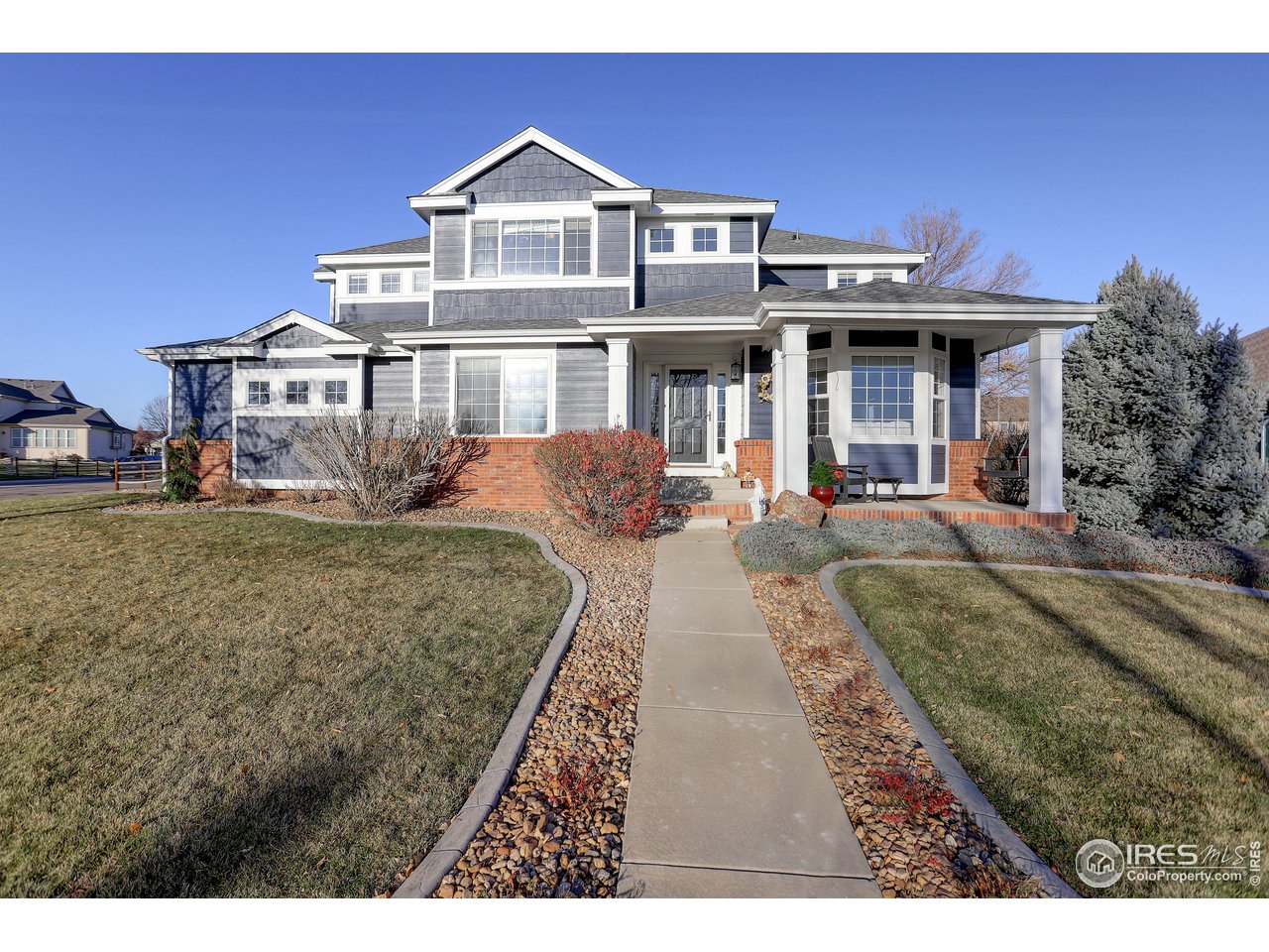 11744 Riverview Road Longmont, CO 80504 - Photo 1 of 40 a front view of a house with a yard