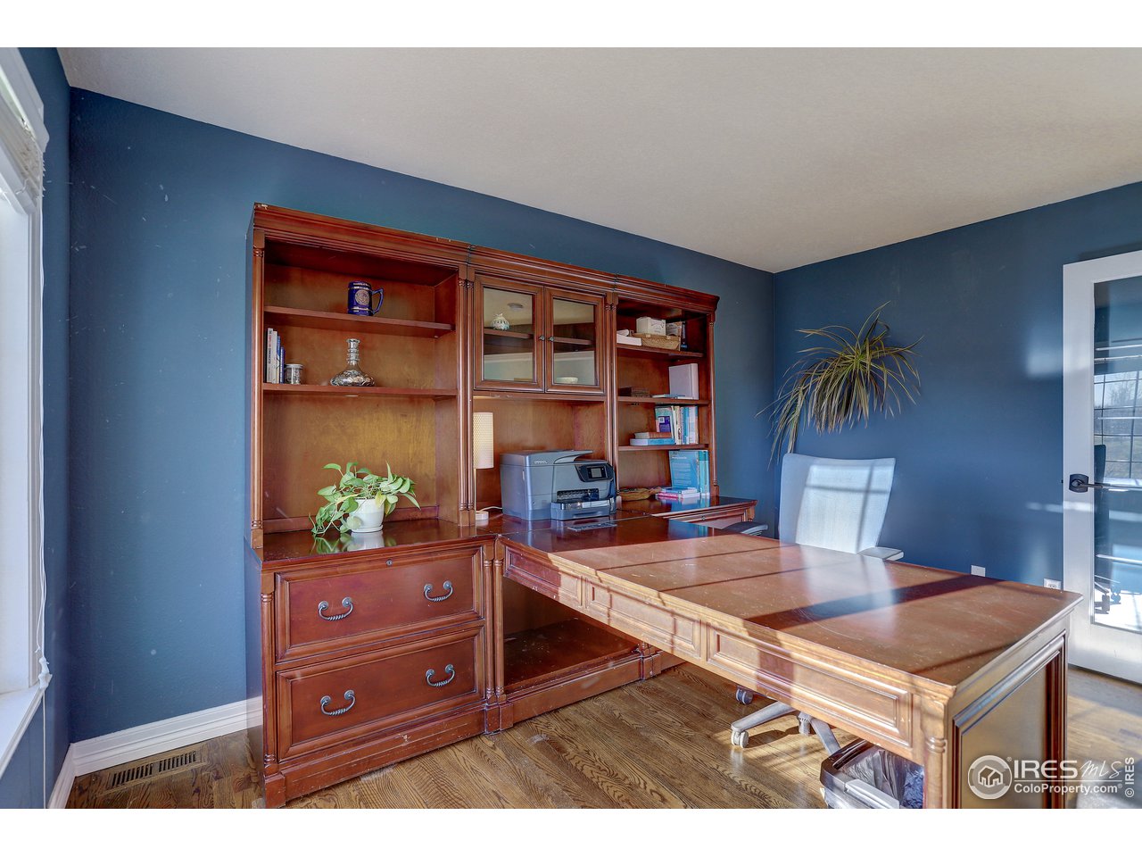 11744 Riverview Road Longmont, CO 80504 - Photo 11 of 40 a living room with furniture and a table