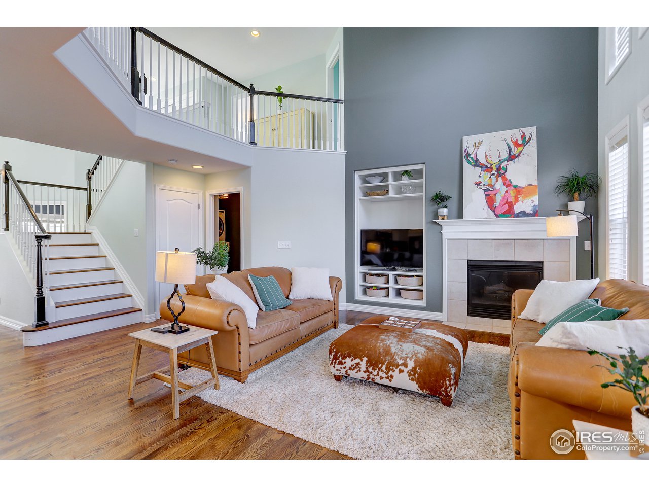 11744 Riverview Road Longmont, CO 80504 - Photo 14 of 40 a living room with furniture and a fireplace