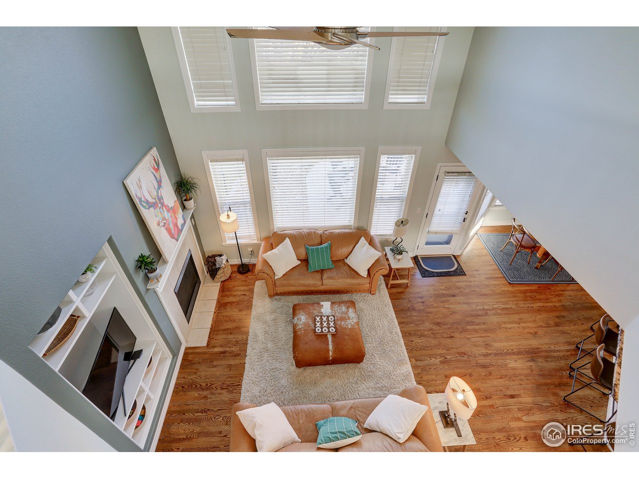 11744 Riverview Road Longmont, CO 80504 - Photo 16 of 40 a living room with furniture and a fireplace