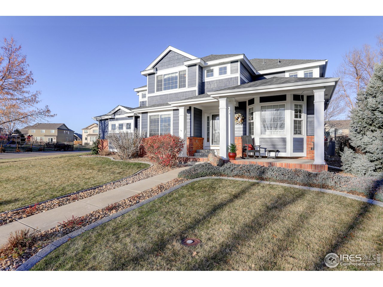 11744 Riverview Road Longmont, CO 80504 - Photo 2 of 40 a front view of a house with a yard