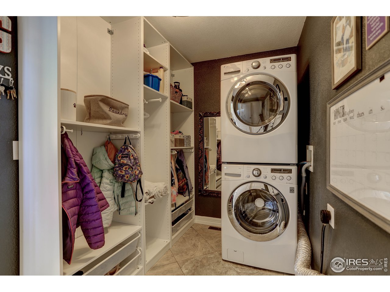 11744 Riverview Road Longmont, CO 80504 - Photo 23 of 40 a view of a storage and utility room with washer and dryer