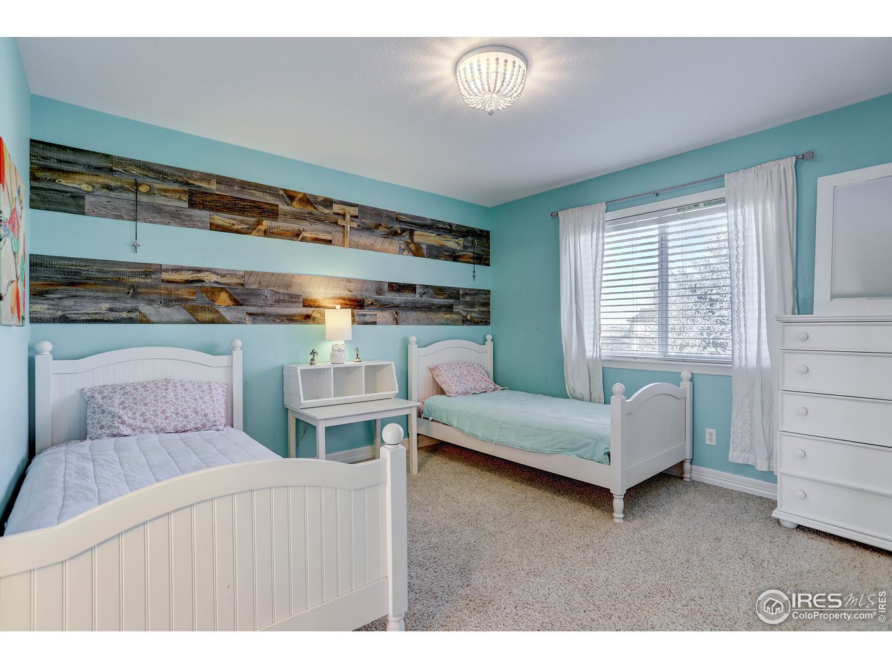 11744 Riverview Road Longmont, CO 80504 - Photo 24 of 40 a living room with furniture and a wooden floor