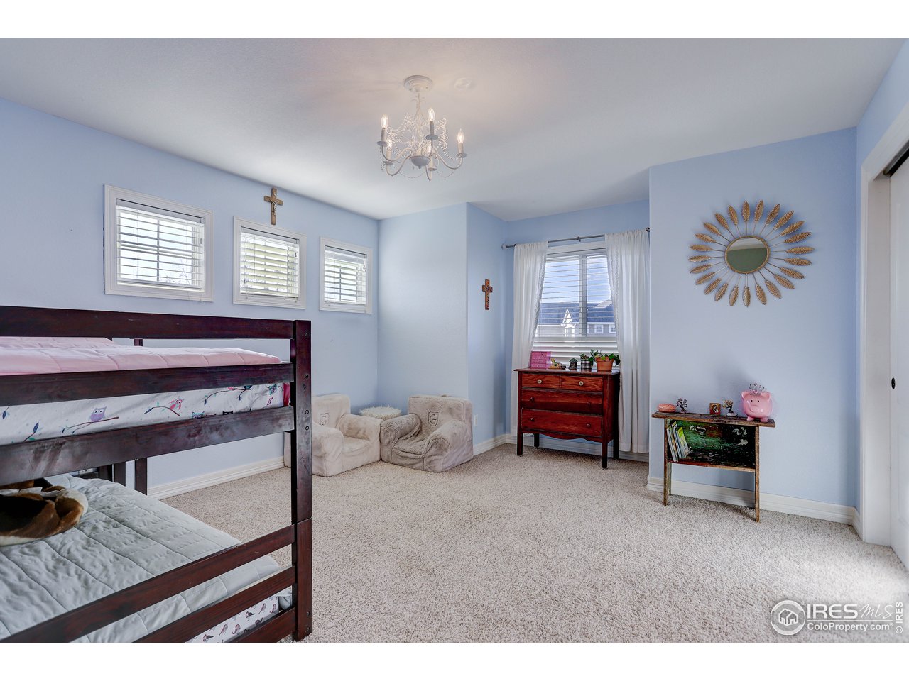 11744 Riverview Road Longmont, CO 80504 - Photo 25 of 40 a living room with furniture and a table