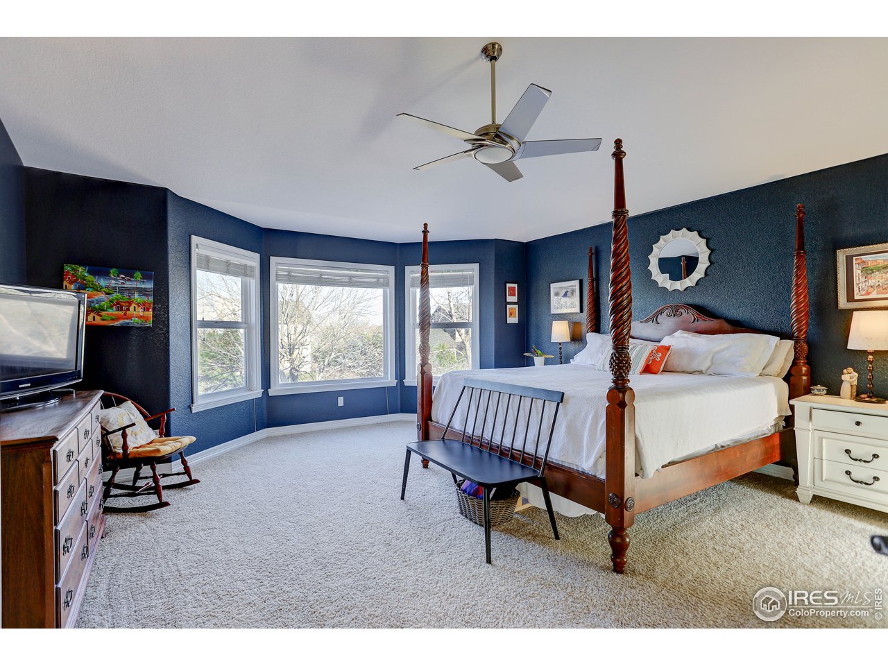 11744 Riverview Road Longmont, CO 80504 - Photo 28 of 40 a bedroom with furniture and a window