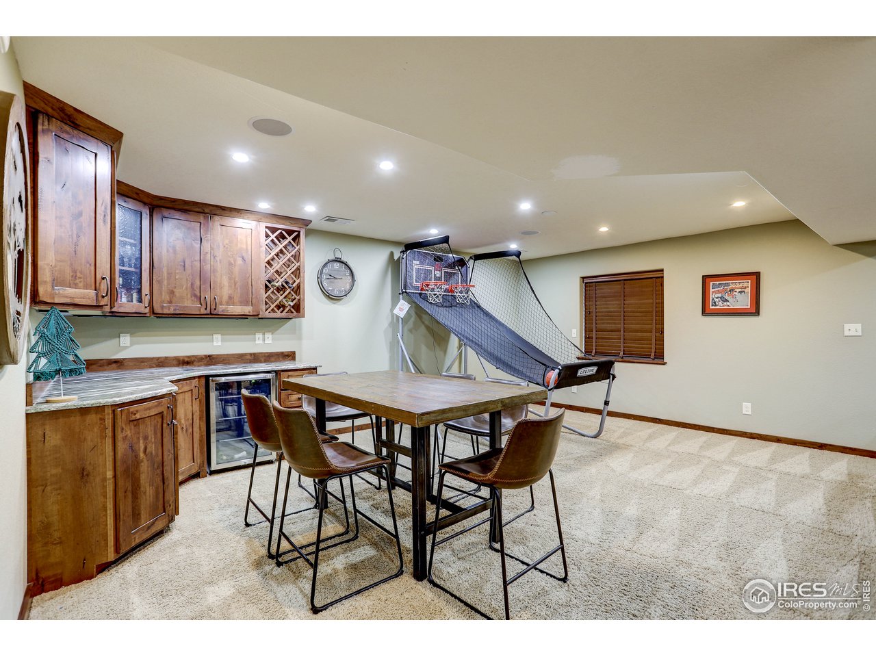 11744 Riverview Road Longmont, CO 80504 - Photo 32 of 40 a view of kitchen with cabinets table and chairs