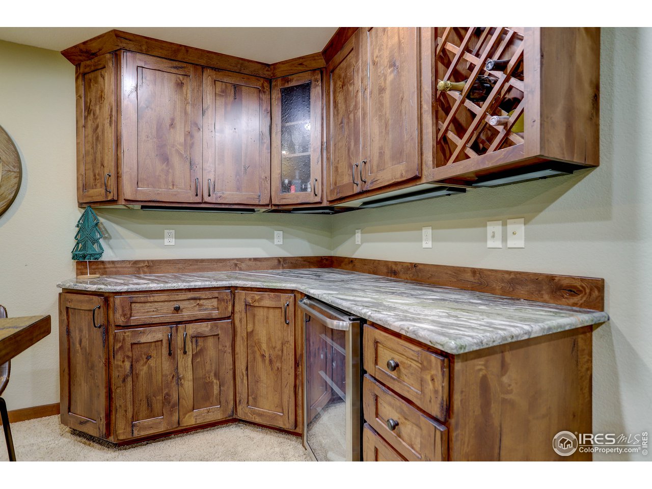 11744 Riverview Road Longmont, CO 80504 - Photo 33 of 40 a kitchen with cabinets appliances and a counter top