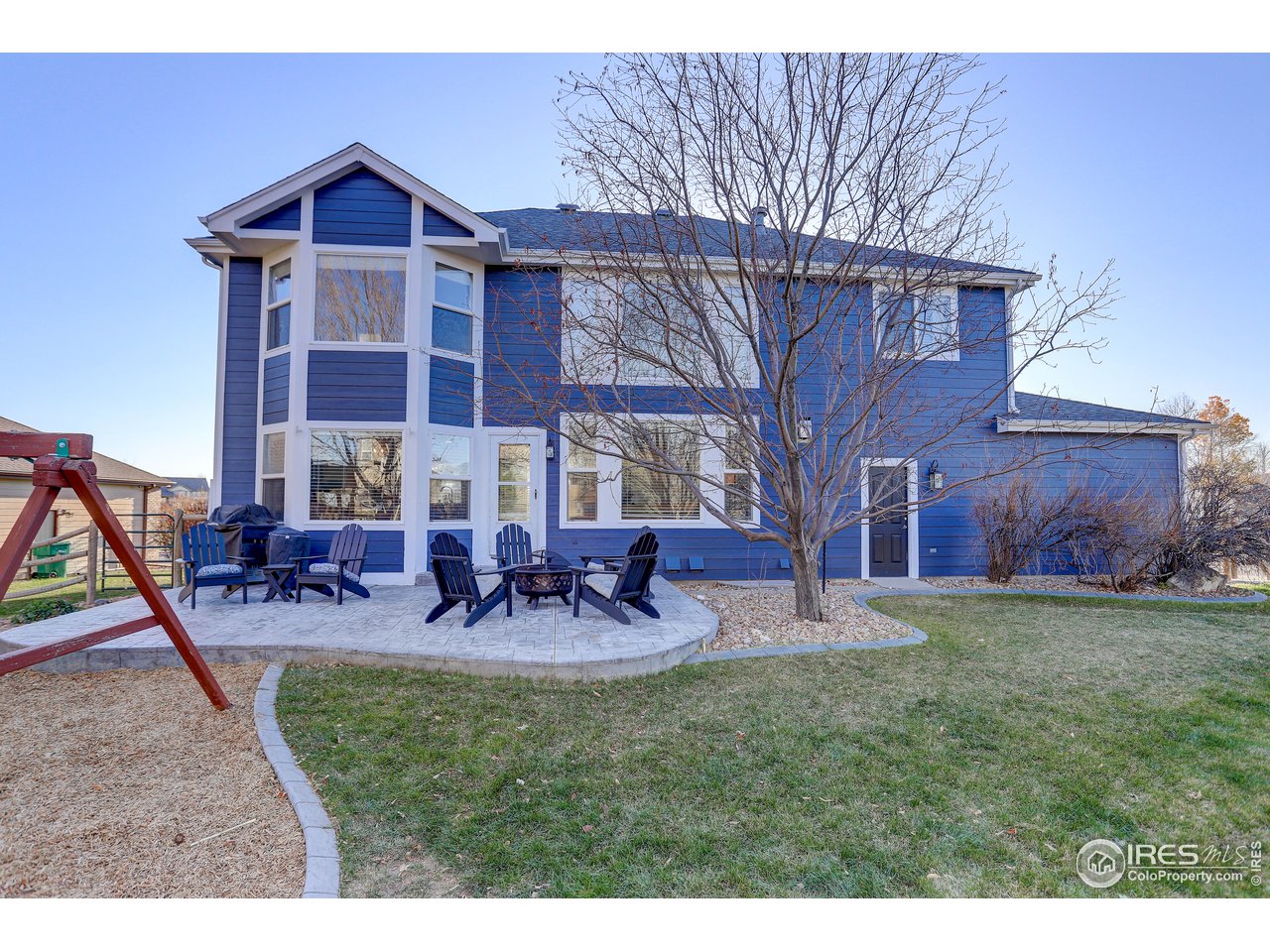 11744 Riverview Road Longmont, CO 80504 - Photo 37 of 40 a view of a house with backyard and sitting area