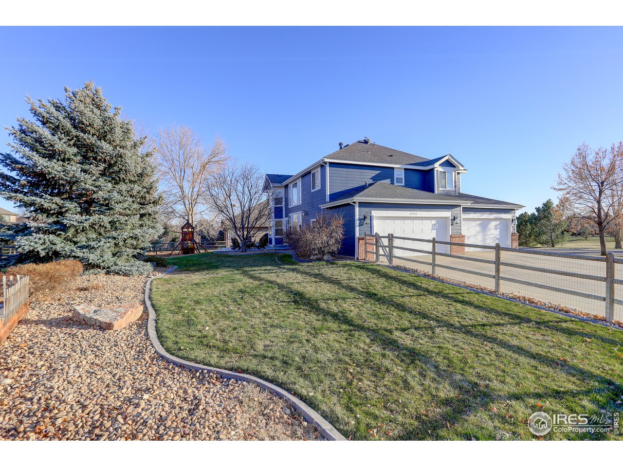 11744 Riverview Road Longmont, CO 80504 - Photo 39 of 40 a view of a house with a yard
