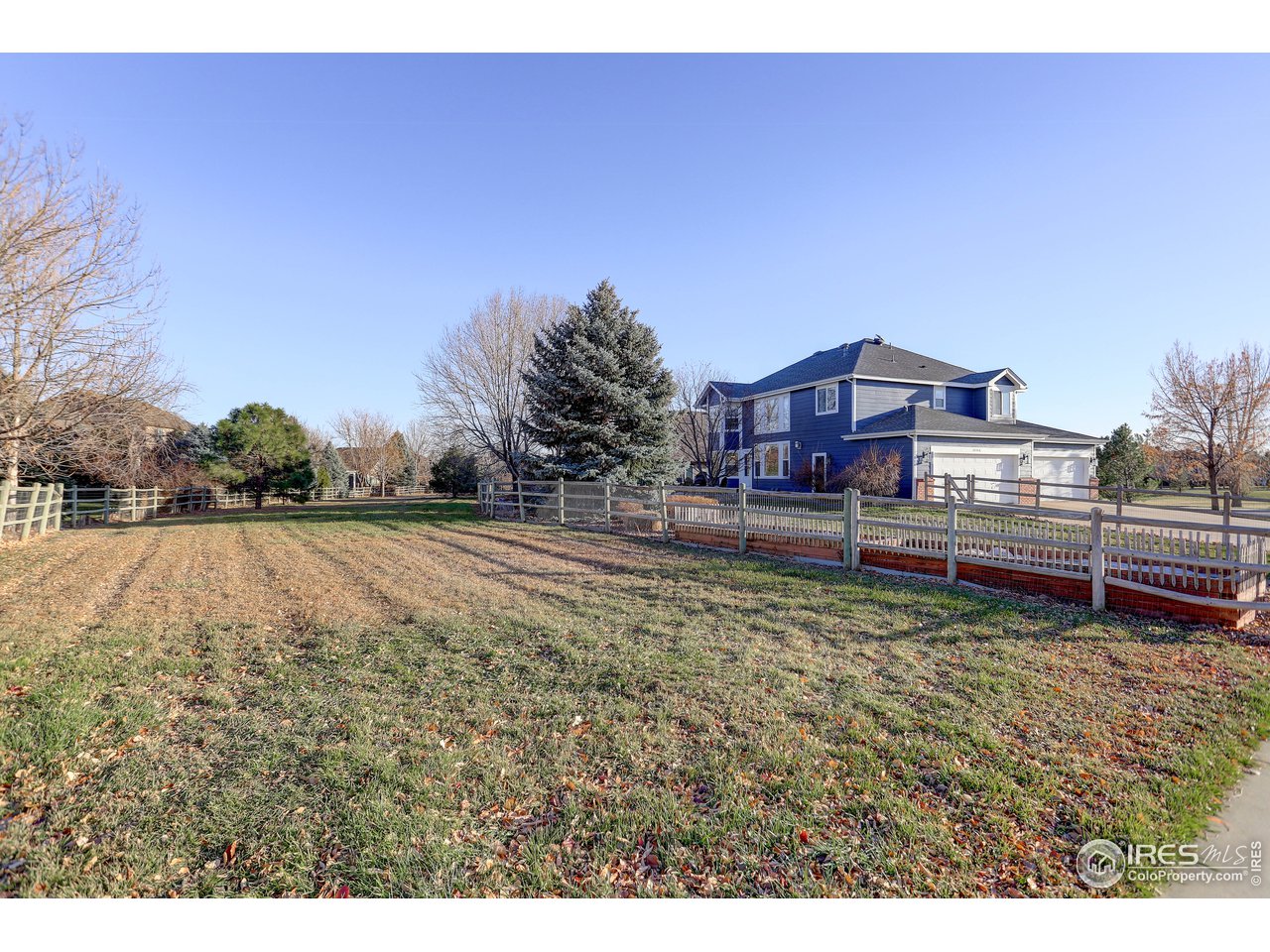 11744 Riverview Road Longmont, CO 80504 - Photo 40 of 40 a view of a yard with a house in the background