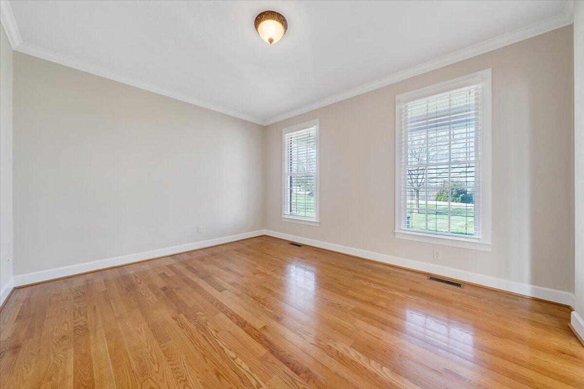 220 Settlers Road Fincastle, VA 24090 - Photo 15 of 106 a view of an empty room with wooden floor and a window