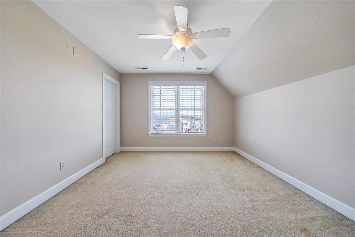 220 Settlers Road Fincastle, VA 24090 - Photo 57 of 106 an empty room with a window and a ceiling fan