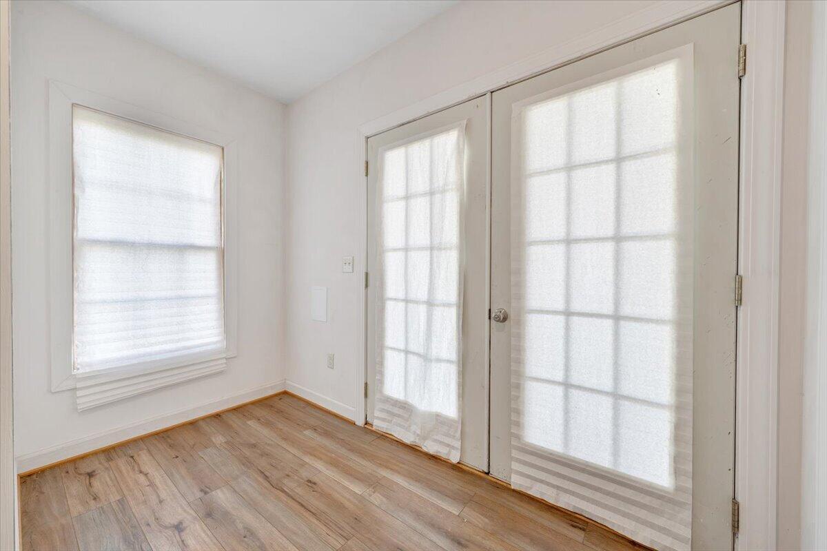 220 Settlers Road Fincastle, VA 24090 - Photo 77 of 106 an empty room with wooden floor and windows