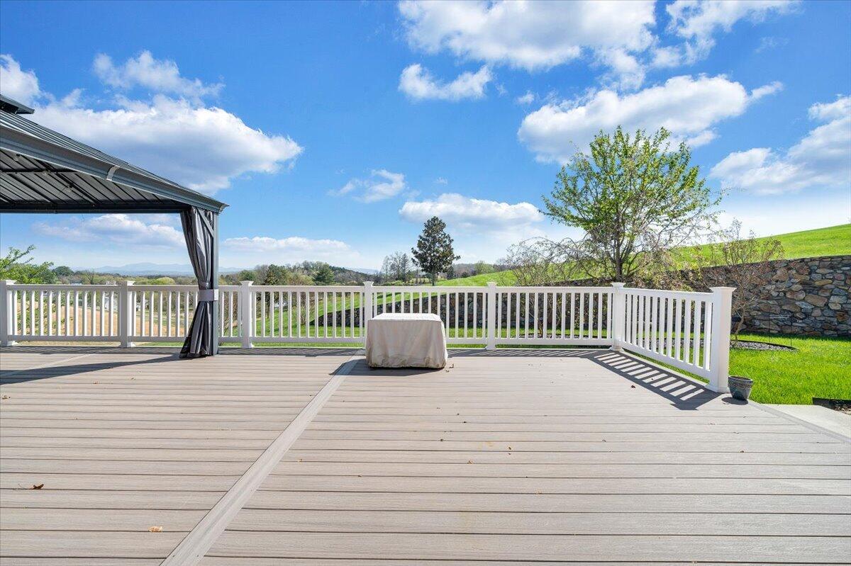 220 Settlers Road Fincastle, VA 24090 - Photo 84 of 106 a view of a deck with a floor to ceiling window and wooden fence