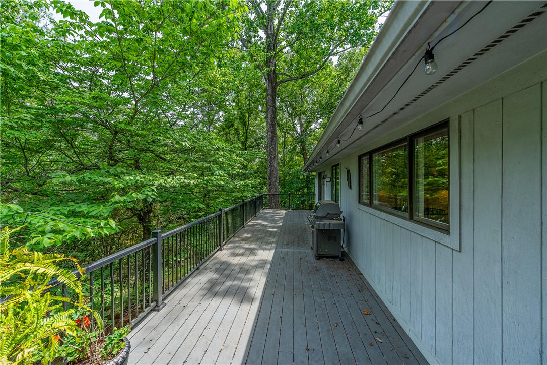 118 Beacon Ridge Circle Salem, SC 29676 - Photo 28 of 45 An inviting deck extends into a lush, tree-filled landscape, perfect for serene outdoor living.